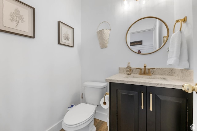 3932 W 2875 N, Plain City, UT 84404 - half bathroom featuring toilet, vanity, wood finished floors, and baseboards
