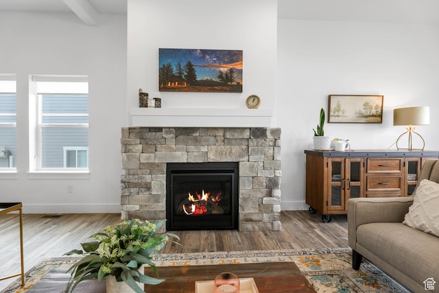 3932 W 2875 N, Plain City, UT 84404 - living area featuring wood finished floors, baseboards, a fireplace, and beam ceiling