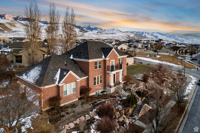 434 S Cardon Ridge Dr, Smithfield, UT 84335 - view of property exterior featuring a balcony, a mountain view, a residential view, and brick siding