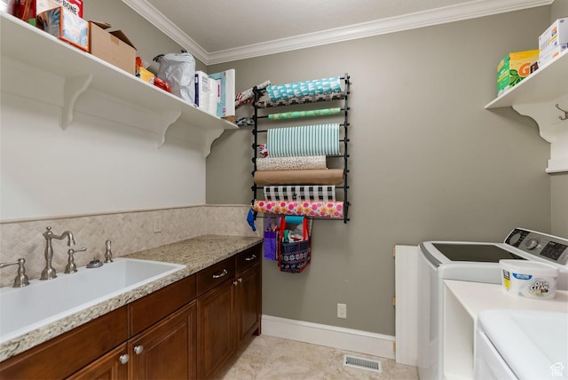 434 S Cardon Ridge Dr, Smithfield, UT 84335 - laundry room featuring separate washer and dryer, crown molding, cabinet space, baseboards, and light tile patterned floors