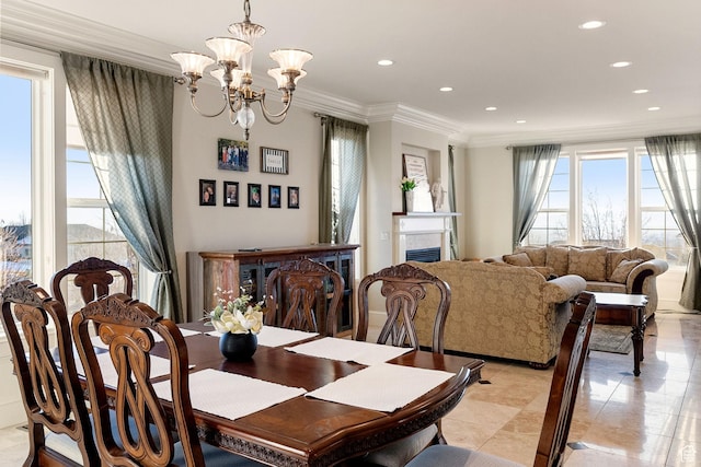 434 S Cardon Ridge Dr, Smithfield, UT 84335 - dining area featuring a chandelier, recessed lighting, crown molding, light tile patterned floors, and a fireplace