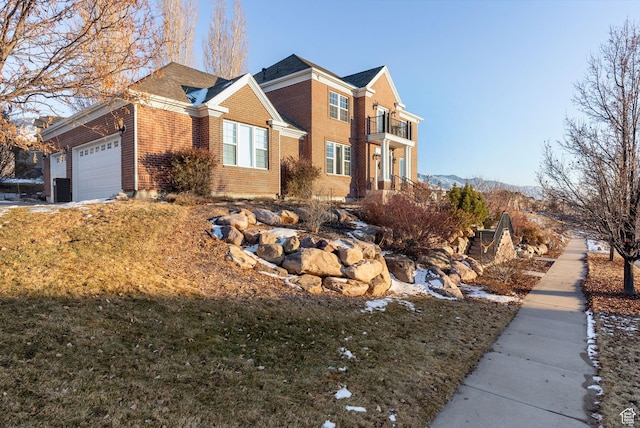 434 S Cardon Ridge Dr, Smithfield, UT 84335 - view of front of house with a balcony, a garage, and brick siding