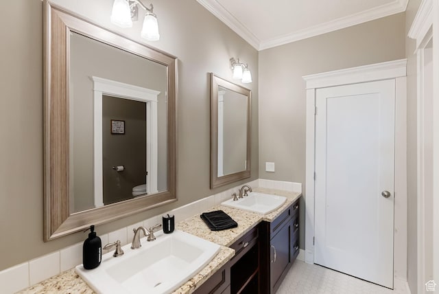 434 S Cardon Ridge Dr, Smithfield, UT 84335 - bathroom featuring double vanity, ornamental molding, and toilet