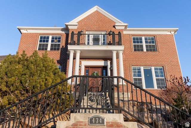 434 S Cardon Ridge Dr, Smithfield, UT 84335 - view of front of property with a balcony, brick siding, and stairs