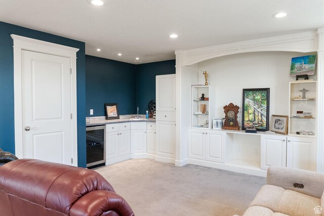 434 S Cardon Ridge Dr, Smithfield, UT 84335 - living room with beverage cooler, light colored carpet, recessed lighting, and wet bar