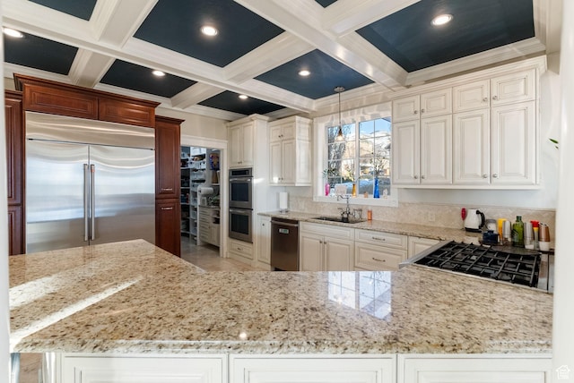 434 S Cardon Ridge Dr, Smithfield, UT 84335 - kitchen with stainless steel appliances, a sink, light stone counters, beamed ceiling, and coffered ceiling
