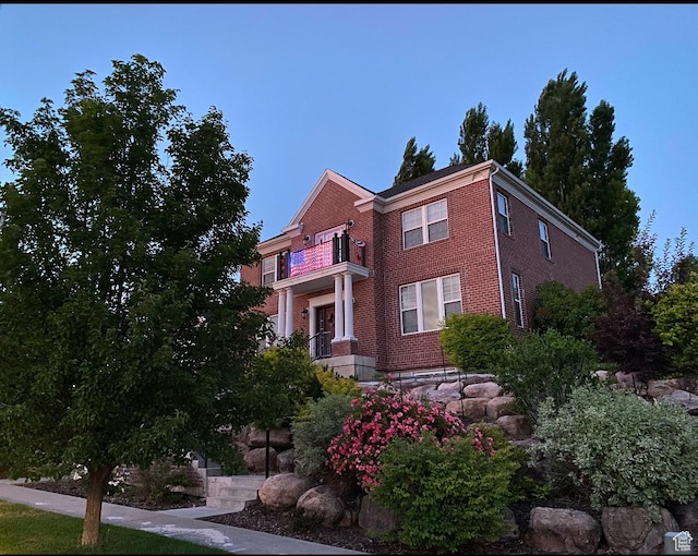 434 S Cardon Ridge Dr, Smithfield, UT 84335 - view of front of house with brick siding and a balcony