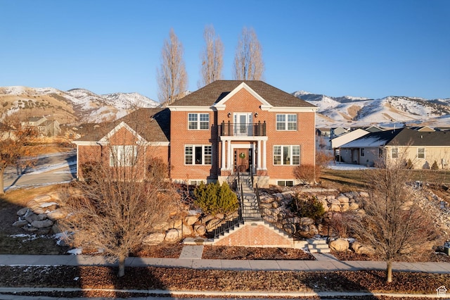 434 S Cardon Ridge Dr, Smithfield, UT 84335 - colonial home with a balcony, a mountain view, and brick siding