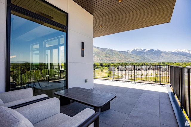 1920 E Rodeo Walk Dr Unit 516, Holladay, UT 84117 - view of patio / terrace featuring a mountain view and a balcony
