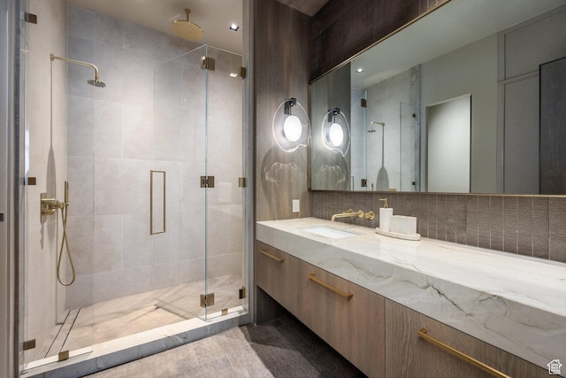 1920 E Rodeo Walk Dr Unit 516, Holladay, UT 84117 - full bathroom featuring a shower stall, vanity, and decorative backsplash