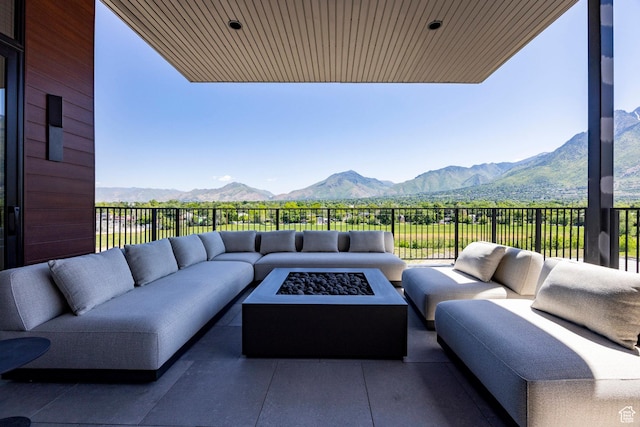 1920 E Rodeo Walk Dr Unit 516, Holladay, UT 84117 - view of patio with an outdoor living space with a fire pit and a mountain view
