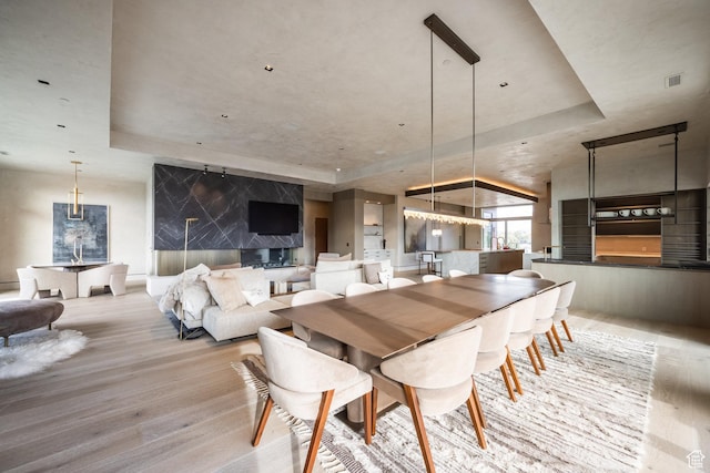 1920 E Rodeo Walk Dr Unit 516, Holladay, UT 84117 - dining space with a tray ceiling and wood finished floors