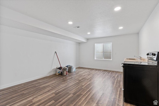 4590 E Silver Moon Dr Unit 3007, Eagle Mountain, UT 84005 - interior space featuring dark hardwood / wood-style flooring, washer / clothes dryer, and a textured ceiling