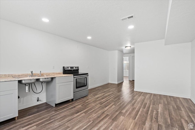 4590 E Silver Moon Dr Unit 3007, Eagle Mountain, UT 84005 - kitchen featuring dark hardwood / wood-style flooring, stainless steel electric stove, and white cabinets