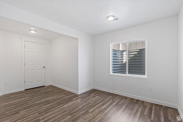 4590 E Silver Moon Dr Unit 3007, Eagle Mountain, UT 84005 - spare room featuring dark hardwood / wood-style floors and a textured ceiling