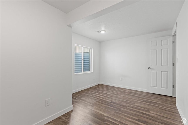 4590 E Silver Moon Dr Unit 3007, Eagle Mountain, UT 84005 - spare room featuring dark hardwood / wood-style floors and a textured ceiling