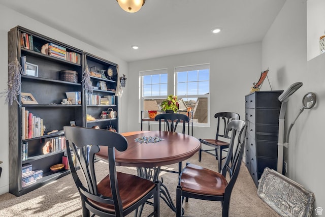view of carpeted dining area