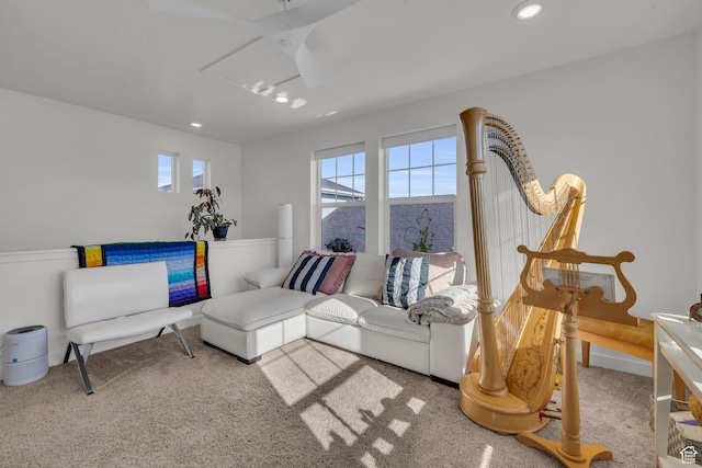 living room with a wealth of natural light and light colored carpet