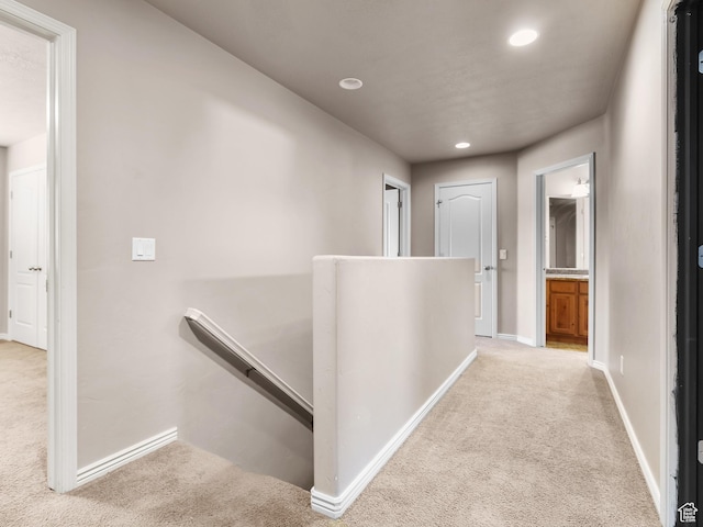 hall with light carpet