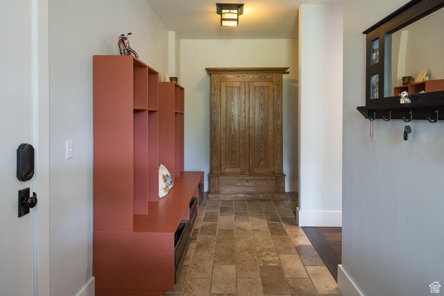 424 E Secret Cove Ct, Moab, UT 84532 - hallway with baseboards and stone finish flooring