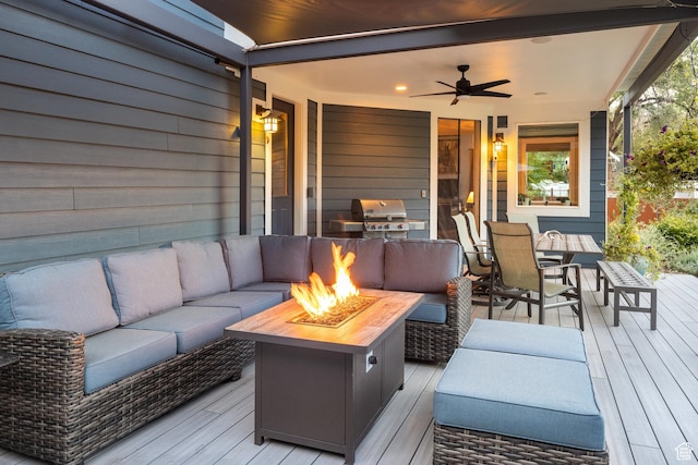 424 E Secret Cove Ct, Moab, UT 84532 - wooden deck with outdoor dining area, an outdoor living space with a fire pit, ceiling fan, and a grill