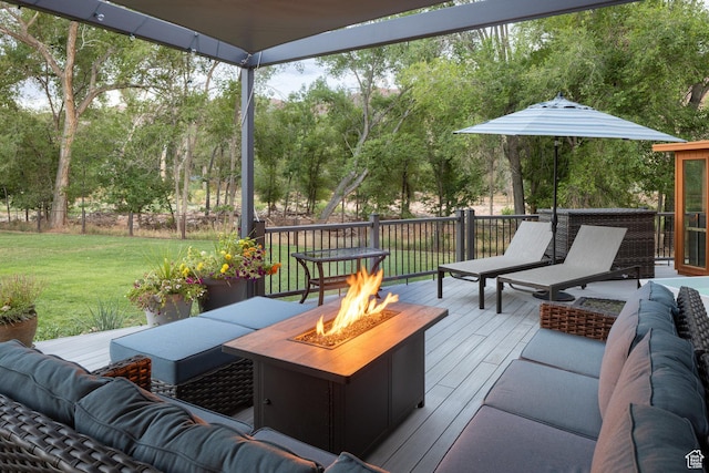 424 E Secret Cove Ct, Moab, UT 84532 - wooden deck with a lawn and an outdoor living space with a fire pit