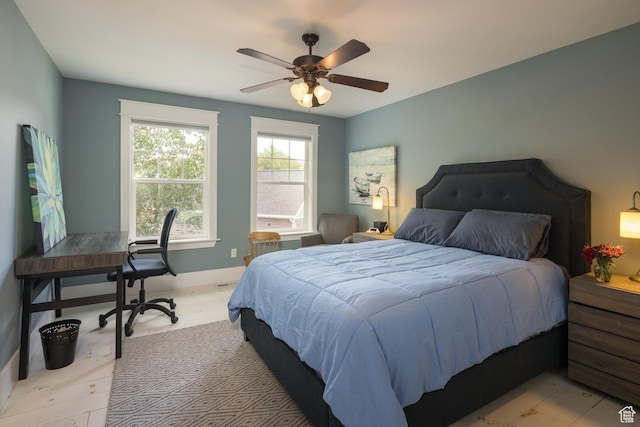 424 E Secret Cove Ct, Moab, UT 84532 - bedroom with baseboards, ceiling fan, and light wood-type flooring