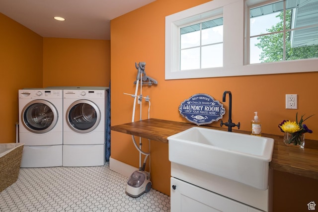 424 E Secret Cove Ct, Moab, UT 84532 - laundry room featuring a sink, laundry area, washing machine and dryer, and a healthy amount of sunlight