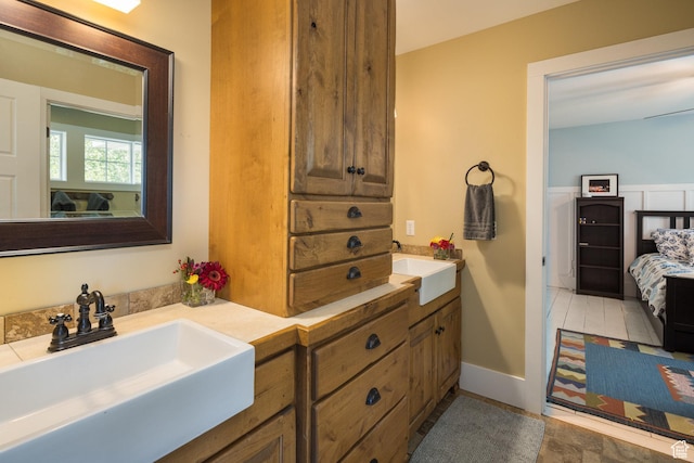 424 E Secret Cove Ct, Moab, UT 84532 - ensuite bathroom with double vanity, a sink, and ensuite bath