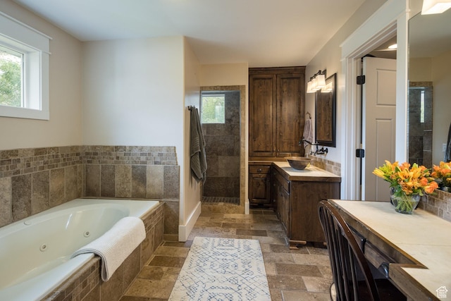 424 E Secret Cove Ct, Moab, UT 84532 - full bath featuring plenty of natural light, stone tile flooring, and tiled shower
