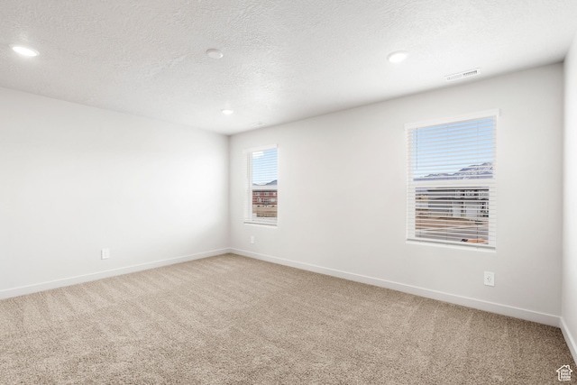 3141 W 3500 S Unit 113, West Haven, UT 84401 - spare room with visible vents, recessed lighting, baseboards, and light carpet