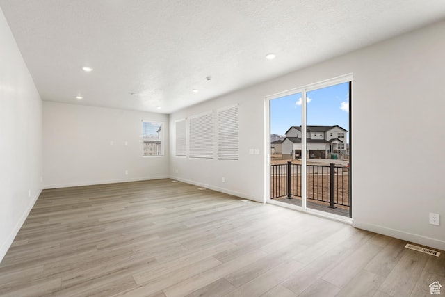 3141 W 3500 S Unit 113, West Haven, UT 84401 - spare room featuring recessed lighting, baseboards, visible vents, and light wood-style floors
