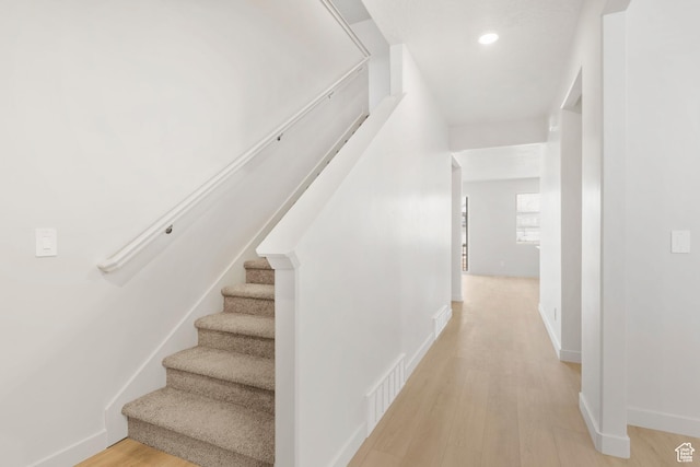 3141 W 3500 S Unit 113, West Haven, UT 84401 - hallway with visible vents, light wood-style floors, baseboards, stairway, and recessed lighting