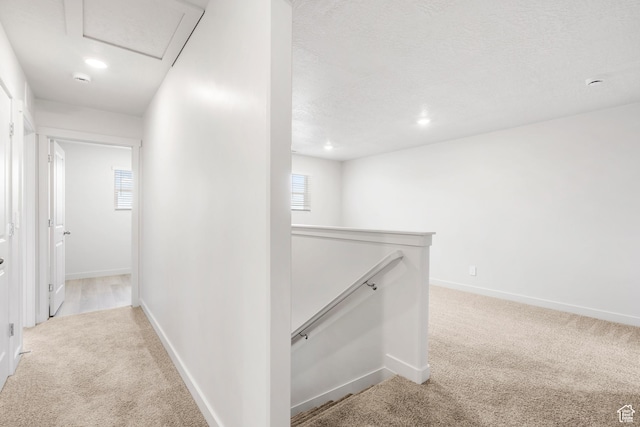 3141 W 3500 S Unit 113, West Haven, UT 84401 - corridor featuring light colored carpet, baseboards, an upstairs landing, and a wealth of natural light
