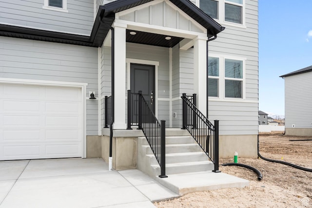 3141 W 3500 S Unit 113, West Haven, UT 84401 - view of exterior entry with board and batten siding and concrete driveway
