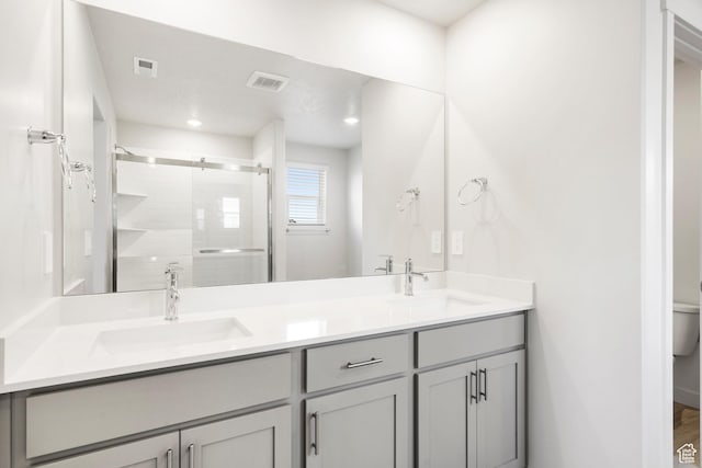 3141 W 3500 S Unit 113, West Haven, UT 84401 - bathroom featuring a sink, a stall shower, double vanity, and visible vents