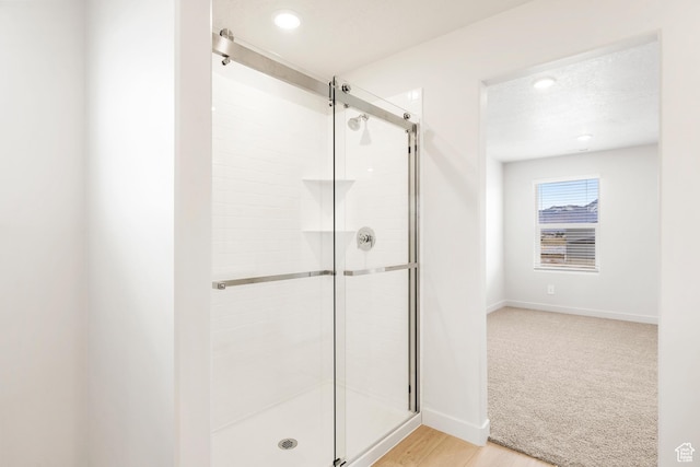 3141 W 3500 S Unit 113, West Haven, UT 84401 - bathroom with baseboards, recessed lighting, wood finished floors, and a shower stall