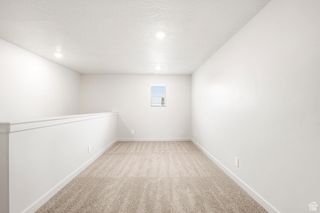 3141 W 3500 S Unit 113, West Haven, UT 84401 - basement featuring baseboards, recessed lighting, a textured ceiling, and light colored carpet