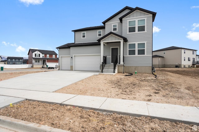3141 W 3500 S Unit 113, West Haven, UT 84401 - traditional-style house with a garage, board and batten siding, driveway, and a residential view