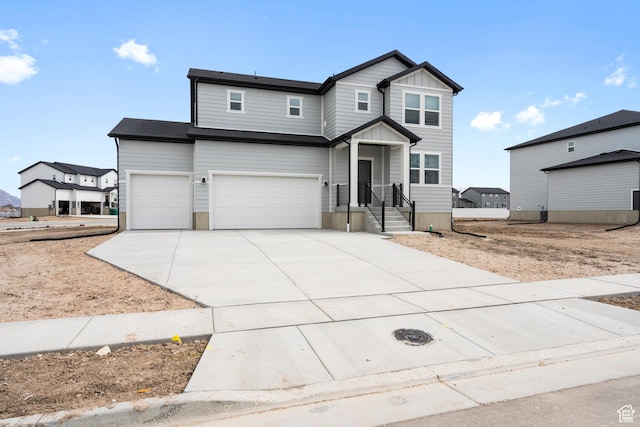3141 W 3500 S Unit 113, West Haven, UT 84401 - view of front of home with concrete driveway, board and batten siding, and a garage