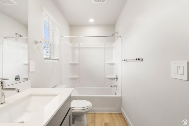 3141 W 3500 S Unit 113, West Haven, UT 84401 - bathroom with visible vents, wood finished floors, vanity, toilet, and washtub / shower combination