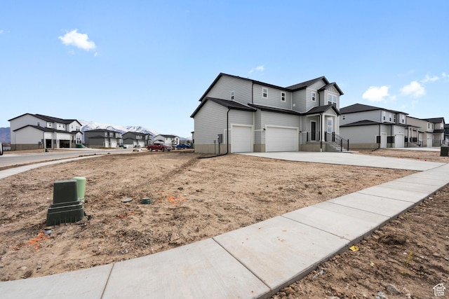 3141 W 3500 S Unit 113, West Haven, UT 84401 - view of side of property with a residential view, an attached garage, and driveway