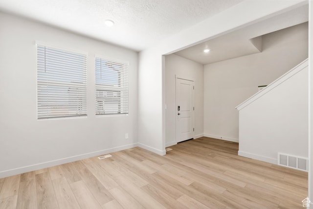 3141 W 3500 S Unit 113, West Haven, UT 84401 - empty room with baseboards, visible vents, and light wood-type flooring
