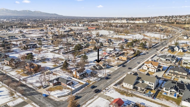 snowy aerial view with a mountain view