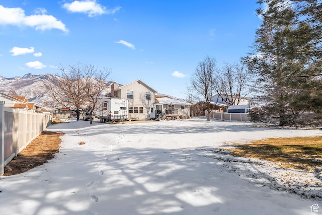 snow covered property featuring a mountain view