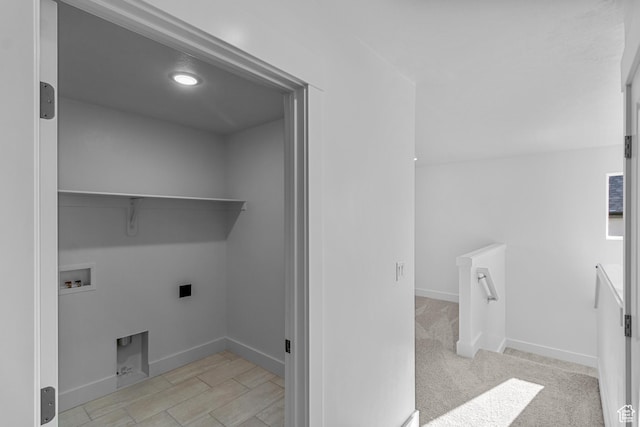 washroom with light colored carpet and hookup for a washing machine