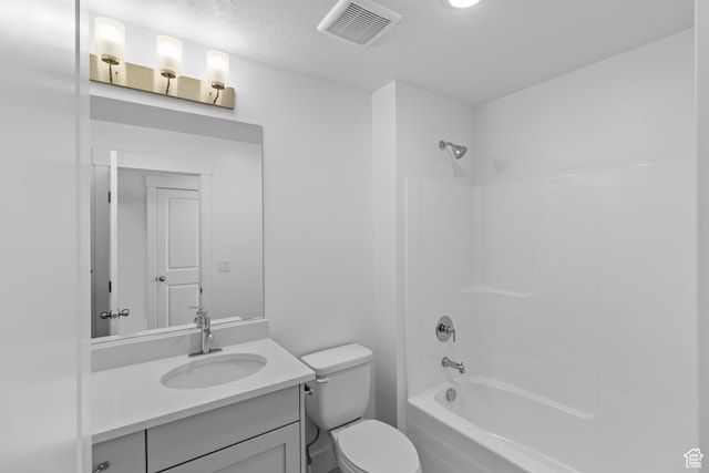 full bathroom with vanity, bathtub / shower combination, and toilet