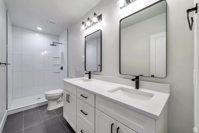 1521 E Thorpe Dr, Eagle Mountain, UT 84005 - bathroom featuring tile patterned flooring, toilet, visible vents, and a sink