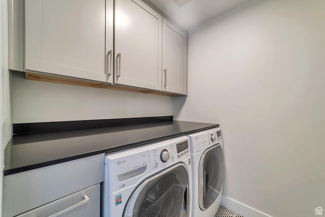 1521 E Thorpe Dr, Eagle Mountain, UT 84005 - laundry area featuring washing machine and dryer, cabinet space, and baseboards