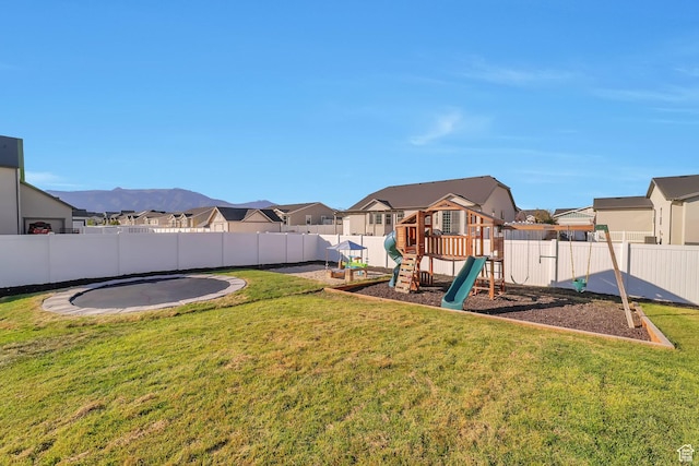 1521 E Thorpe Dr, Eagle Mountain, UT 84005 - view of yard with a playground, a trampoline, a fenced backyard, and a residential view